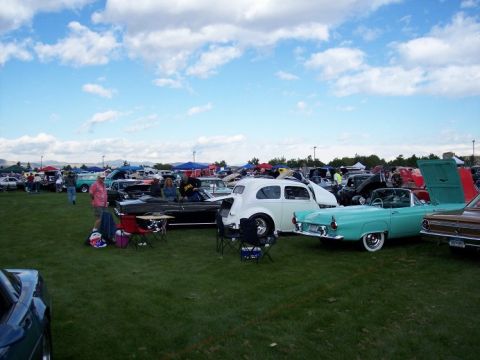 1972 Ford Ranchero - A gathering of classic cars at an outdoor event, with attendees observing the vehicles on display.