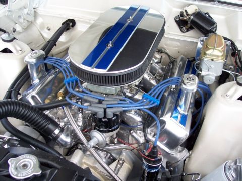 1972 Ford Ranchero - Close-up of a custom engine bay polished components and blue accents.