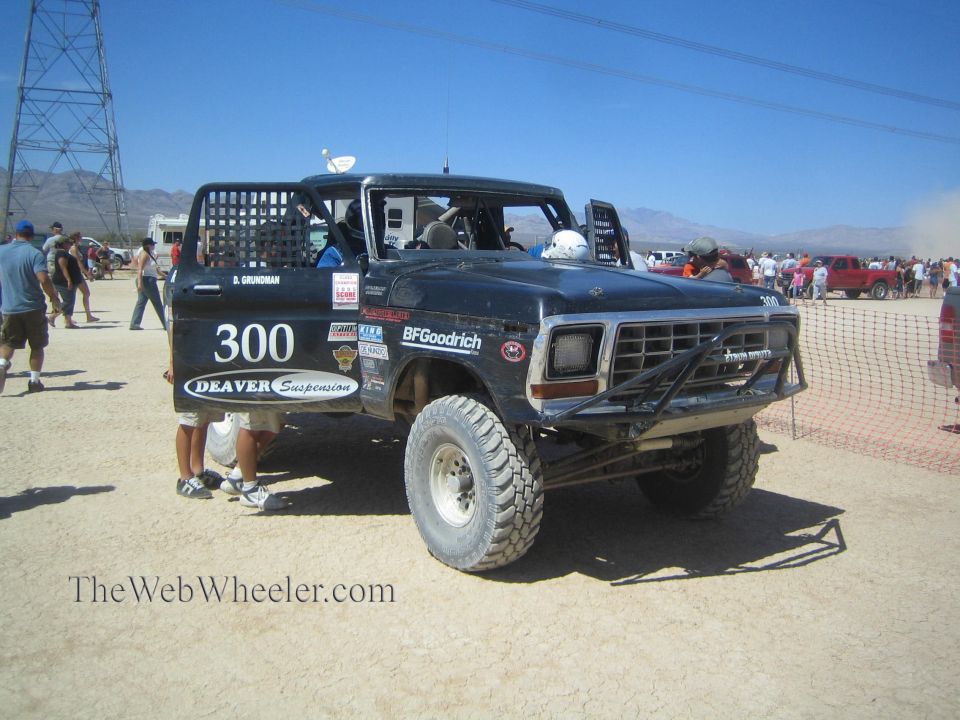 Black classic Ford pickup race truck number 300 at desert race