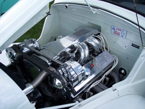 1972 Ford Ranchero - A highly polished V8 engine is visible with the hood open, chrome components and a warning sticker.