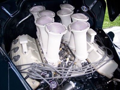 1972 Ford Ranchero - A close-up view of a V8 engine eight prominent intake stacks with mesh covers.