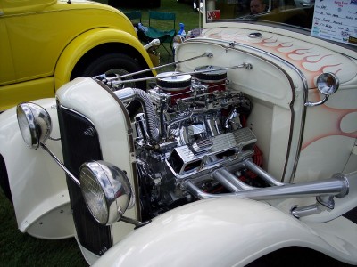 1972 Ford Ranchero - A close-up view of a custom hot rod's powerful engine and flame detailing.