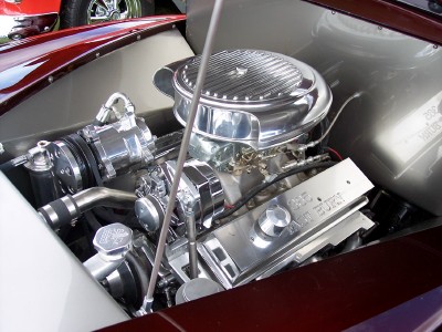 1972 Ford Ranchero - A polished V8 engine with chrome accents is visible in the engine bay of a custom vehicle.
