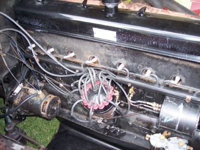 1972 Ford Ranchero - The engine bay of a vehicle, with focus on the distributor and wiring.