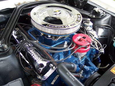 1972 Ford Ranchero - Close-up of a 1972 Ford Ranchero engine bay, showing the blue Ford Cobra engine with chrome accents.