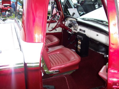 1972 Ford Ranchero - Interior view of a classic red pickup truck, its vintage seats and dashboard details.