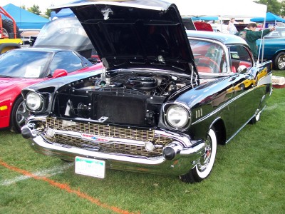 1972 Ford Ranchero - A classic black Chevrolet with its hood open is displayed at an outdoor event.