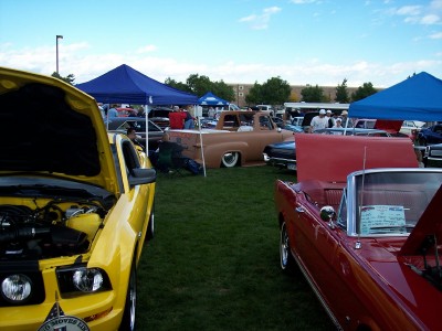 1972 Ford Ranchero - Multiple vehicles are displayed on a grassy field under tents at an outdoor car show.