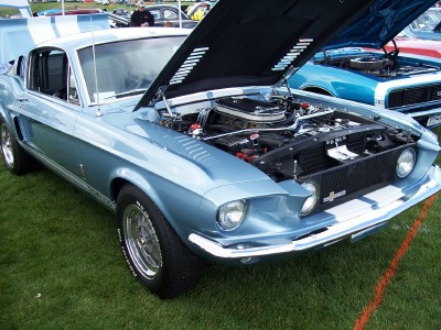 1972 Ford Ranchero - A light blue 1967 Ford Mustang Fastback is displayed with its hood open, revealing the engine compartment.