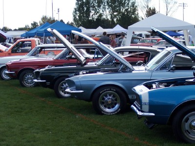 1972 Ford Ranchero - A blue 1972 Ford Ranchero is displayed with its hood open at a car show, alongside other classic vehicles.