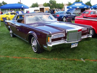1972 Ford Ranchero - Burgundy 1972 Lincoln Continental Mark IV shown at an outdoor car show with other vehicles present.
