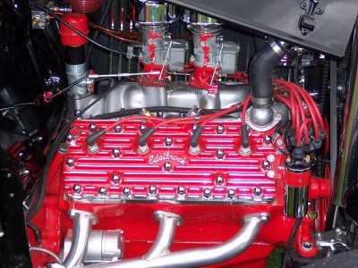 1972 Ford Ranchero - Close-up of a V8 engine dual carburetors and red Edelbrock valve covers.