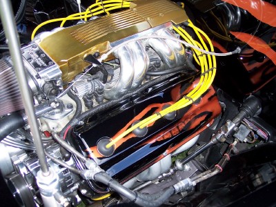 1972 Ford Ranchero - The engine bay features a V8 motor with custom paint and chrome accents, including yellow spark plug wires.
