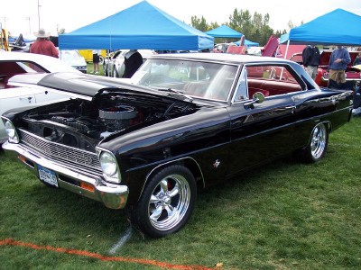 1972 Ford Ranchero - A black 1966 Chevrolet Nova coupe is displayed with its hood open, revealing the engine.