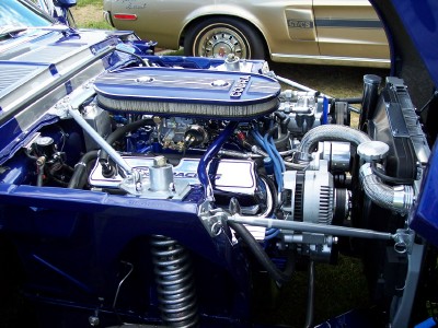 1972 Ford Ranchero - Engine bay of a 1972 Ford Ranchero, a Cobra air cleaner and custom blue paint. A second vehicle is visible behind it.
