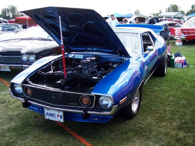 1972 Ford Ranchero - Blue 1970 AMC Javelin at a car show, hood raised to display the engine bay.