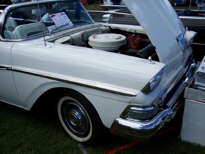 1972 Ford Ranchero - A white 1957 Ford Fairlane convertible is displayed with its hood open, revealing the engine and air cleaner assembly.