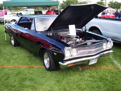 1972 Ford Ranchero - A black 1966 Chevrolet Chevelle is displayed with its hood open at an outdoor event.