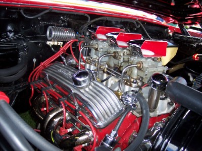 1972 Ford Ranchero - Close-up view of a modified V8 engine with multiple carburetors and shiny chrome components.