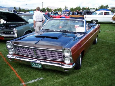 1972 Ford Ranchero - A two-tone 1966 Ford Fairlane convertible with a hood scoop is displayed at a car show.
