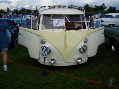 1972 Ford Ranchero - Volkswagen Type 2 (Bus) displayed with its doors open at an outdoor car show.