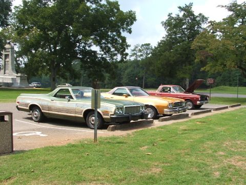1966 Ford Ranchero - Three Ford Rancheros and a pickup truck parked in a lot.