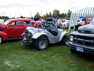 1972 Ford Ranchero - A custom dune buggy is displayed at an outdoor car show alongside other vehicles.