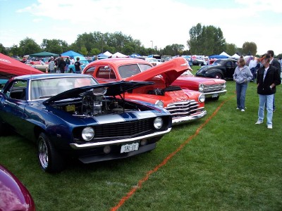 1972 Ford Ranchero - Several classic cars are displayed with their hoods open on a grassy field at an outdoor event.