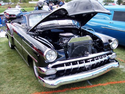 1972 Ford Ranchero - Black 1953 Chevrolet Bel Air convertible on display with its hood up.