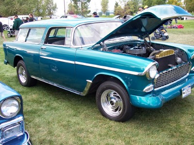 1972 Ford Ranchero - A teal 1955 station wagon is displayed with its hood open, revealing the engine compartment.