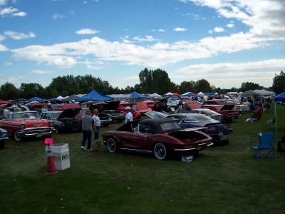 1972 Ford Ranchero - A gathering of vintage automobiles displayed outdoors on a sunny day with scattered clouds.