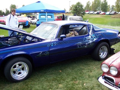1972 Ford Ranchero - A custom blue coupe, possibly a 1972 model, is displayed at an outdoor car show.