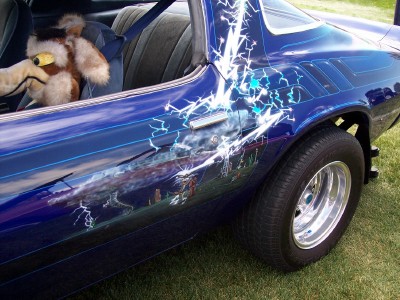 1972 Ford Ranchero - Custom painted car with a lightning bolt mural and a plush toy inside.