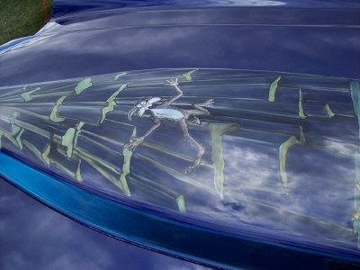 1972 Ford Ranchero - The hood of a blue car features a custom paint job with the cartoon character Road Runner in motion.