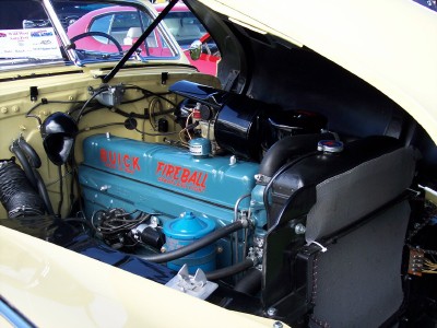 1972 Ford Ranchero - The engine compartment of a classic car is open, revealing a blue Buick Fireball engine.