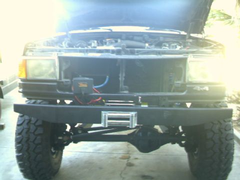 1989 Ford Bronco - This Ford Bronco features an aftermarket bumper with a winch and large off-road tires.
