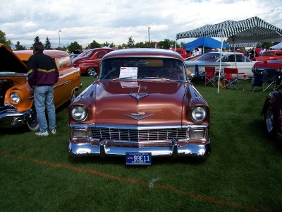 1972 Ford Ranchero - A copper 1956 Chevrolet Bel Air is displayed at an outdoor car show.