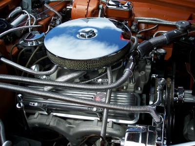 1972 Ford Ranchero - Close-up view of a customized engine bay, polished chrome components and orange painted parts.