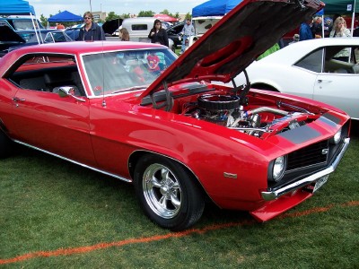 1972 Ford Ranchero - A bright red 1969 Chevrolet Camaro SS is displayed with its hood open, revealing the engine bay.