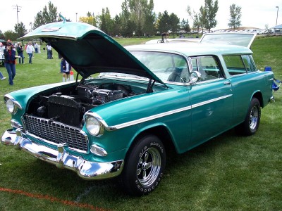 1972 Ford Ranchero - A teal 1955 station wagon is displayed with its hood and tailgate open, revealing the engine compartment.