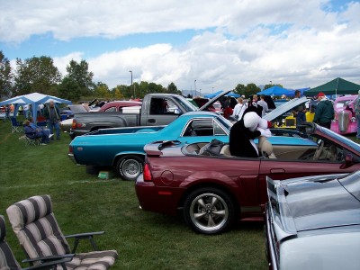 1972 Ford Ranchero - Various vehicles displayed at an outdoor car show event on a partly cloudy day.