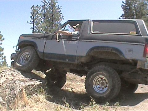 1985 Ford Bronco - This Ford Bronco is navigating a challenging off-road course.