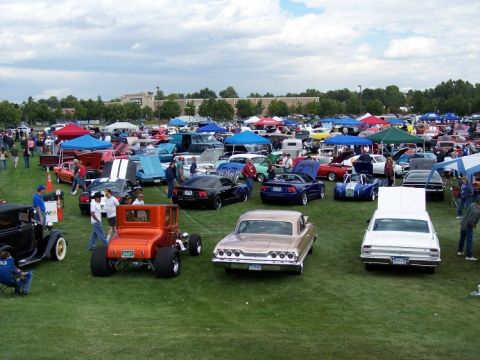1972 Ford Ranchero - A large outdoor car show features numerous vehicles and attendees on a cloudy day.