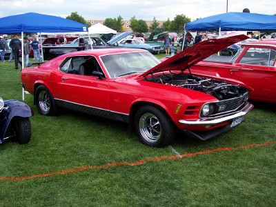 1972 Ford Ranchero - 1970 Ford Mustang Mach 1 on display at a car show, hood raised to reveal the engine.
