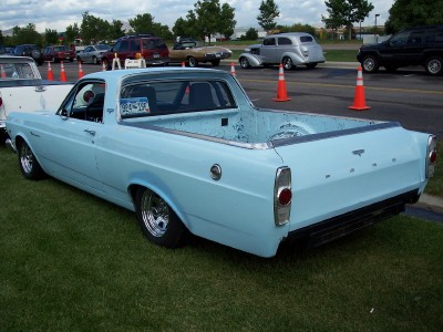 1972 Ford Ranchero - Light blue 1970 Ford Ranchero pickup truck seen at an outdoor car show with other vehicles present.