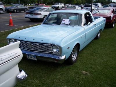 1972 Ford Ranchero - A light blue 1966 Ford Ranchero is displayed on a grassy field with other vehicles in the background.