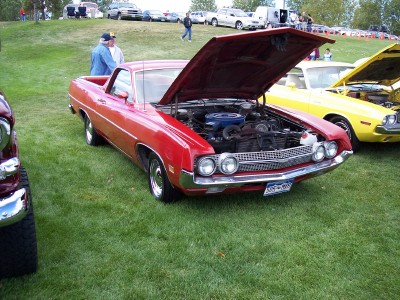 1972 Ford Ranchero - A red 1970 Ford Ranchero is displayed with its hood open at an outdoor car show.