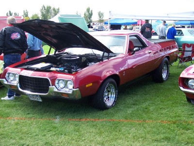 1972 Ford Ranchero - Red 1972 Ford Ranchero displayed at a car show with its hood up.