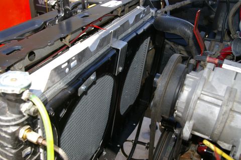 1986 Ford Bronco - This image shows the radiator and electric fan assembly of a vehicle, not the exterior.