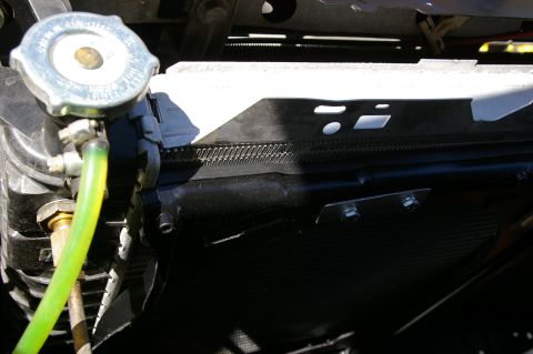 1986 Ford Bronco - Close-up view of a vehicle's radiator and fan shroud assembly.